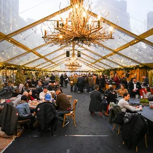 a large group of people sitting at tables