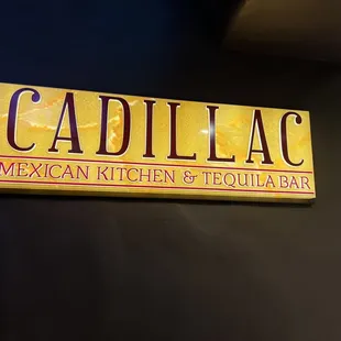 The sign in front of the restaurant....