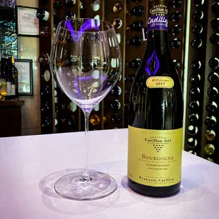 a glass of wine and a bottle of wine