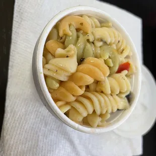 a bowl of pasta on a napkin