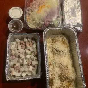 Family meal  for four, chicken Parmesan, ranch potatoes, salad and garlic bread