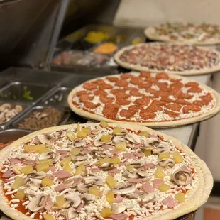 Hawaiin pizza, pepperoni pizza, bbq chicken, supreme...