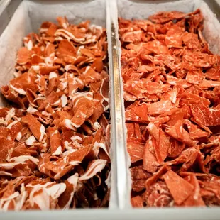 ows two trays of meat