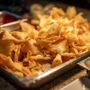 ows a tray of chips and dips