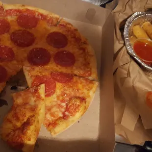 personal pepperoni pizza and mozzarella sticks. had to take a picture before I ate it all. very pleased with the food.