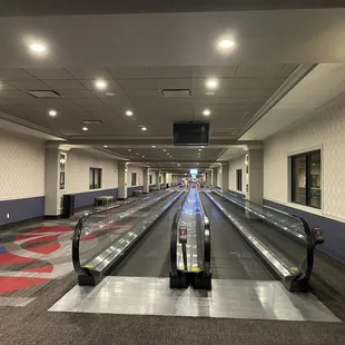 Walking escalators conveniently take you down the hallway to the gaming floor