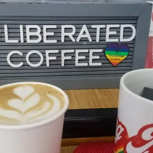 a cup of coffee and a cell phone