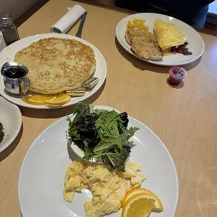 Two eggs with greens, short stack of pancakes, omelette + English muffin. Don't let the photo fool you, these pancakes are amazing