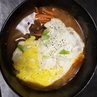 Beef ramen with egg, green onion, and veggies