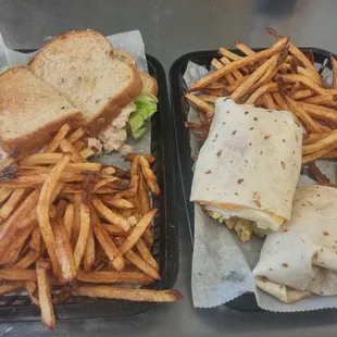 two trays of fries and a sandwich