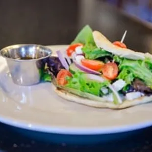 a plate of food with a salad on it