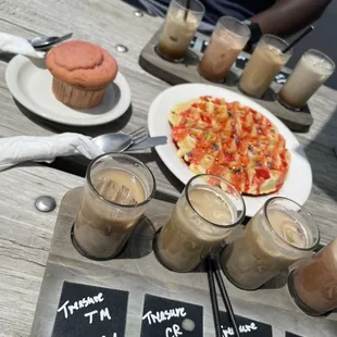 a pizza and drinks on a table