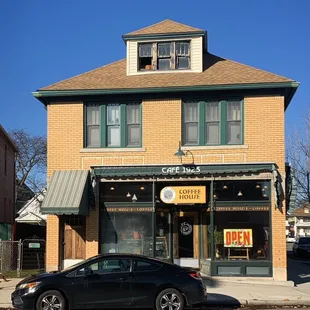 a car parked in front of a coffee shop