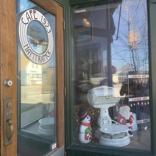 a storefront window with teddy bears in the window