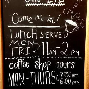 a blackboard with a menu for a coffee shop
