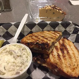 Potato salad, a hot, grilled steak and cheese sandwich with peanut butter/choc chip pie and iced tea.