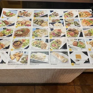 They keep a menu at the counter with photos of the dishes they serve.