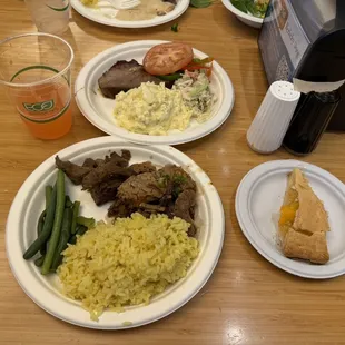 plates of food on a wooden table