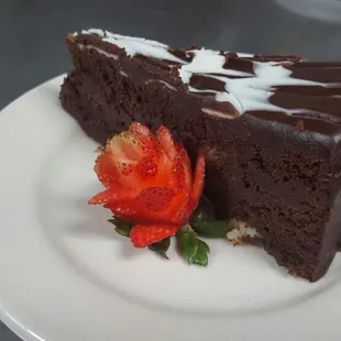 Valentine&apos;s Day chocolate torte and strawberry rose