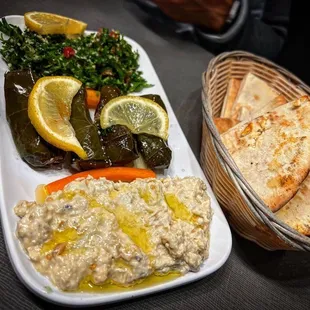 a plate of hummus and pita bread
