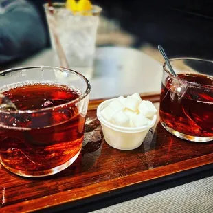 two cups of tea on a tray