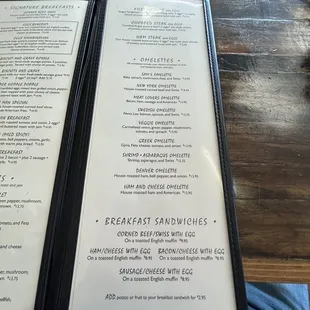 a person holding a menu at a restaurant