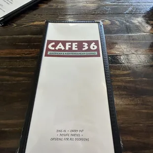 a menu on a wooden table