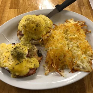 Eggs Benedict with Hash browns.