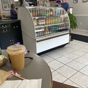Inside seating behind. Lots of drink options. Iced latte