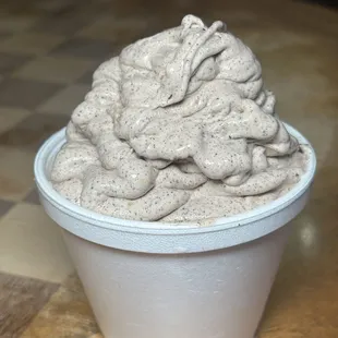 a cup of ice cream on a table