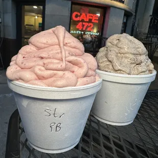 two cups of ice cream on a table