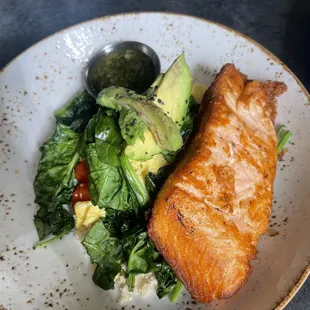 a plate of fish and a salad