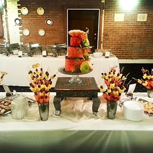 Cafe 54 caters: Custom carved watermelon wedding cake and dessert table