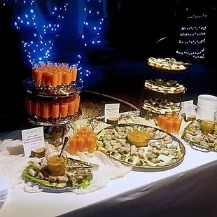 Cafe 54 caters: Appetizer table with vegan spring rolls, caprese bruschetta, &amp; chilled carrot ginger soup shooters