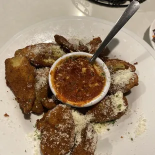 Artichoke petals fried crispy with a delicious marinara sauce!