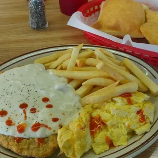 Chicken fried steak with a little hot sauce