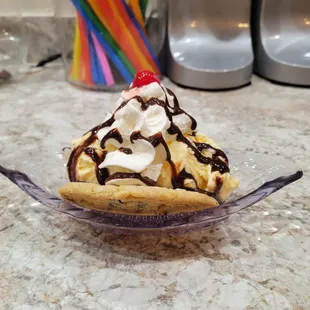a banana split with chocolate sauce and whipped cream