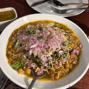a bowl of soup with a spoon