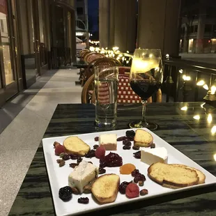 I have the patio to myself tonight! Treated myself to a glass of Malbec and the Planche de Fromages