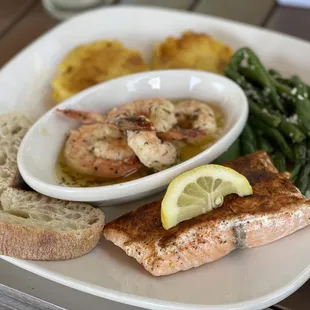 Shrimp and salmon with green beans and corn polenta cakes