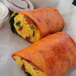 Agora Breakfast Wrap (bacon, egg, cheese, and spinach) with no tomato or onions in a tomato wrap