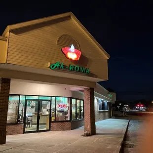 the outside of a restaurant at night