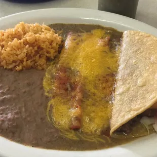 Mexican plate - two cheese enchiladas, crispy beef taco, rice and beans