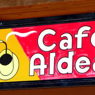 a sign for a cafe