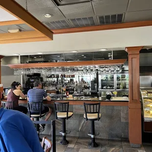 people sitting at tables in a restaurant