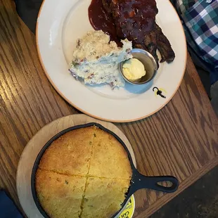 Cherry glazed pork chop, mashed potatoes and corn bread