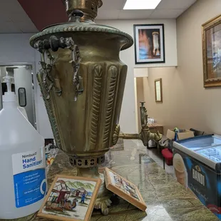 a coffee pot and a book on a table