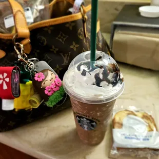 a handbag and a cup of coffee