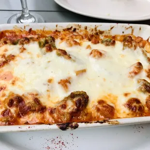 a dish of lasagna on a white plate