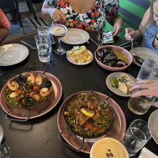 Seafood paella, spicy chicken paella, mussels, espresso martini (the brunette)